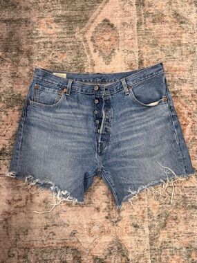 High-Rise Raw Hem Denim Shorts in Blue - Levi’s